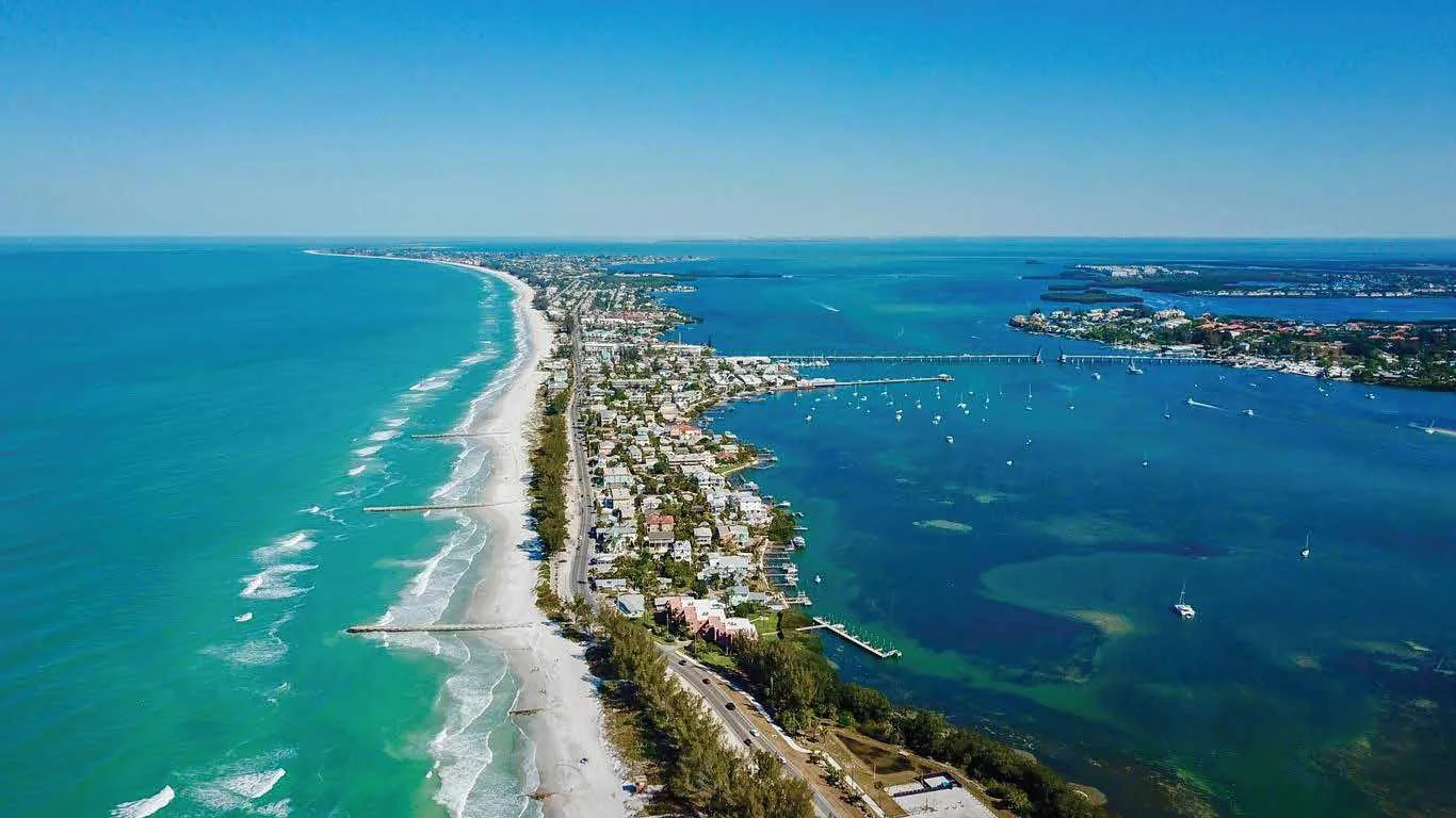 Aerial view of Florida’s coastline, with blue water and coastal homes